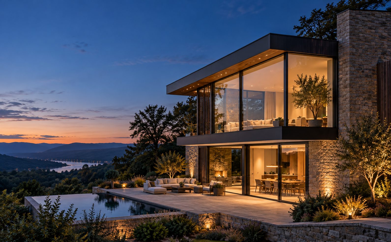 Modern hillside residence with large aluminium glazing at dusk, overlooking the Hudson Valley