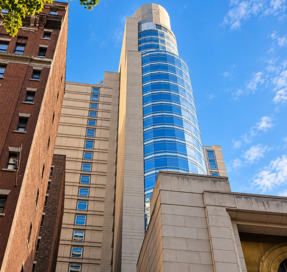 Sofitel New York tower with blue reflective curtain wall glazing
