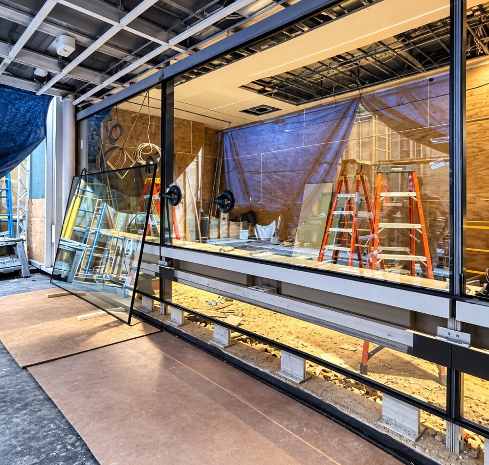 Large storefront glass panel staged for installation at 88 Pine Street, New York
