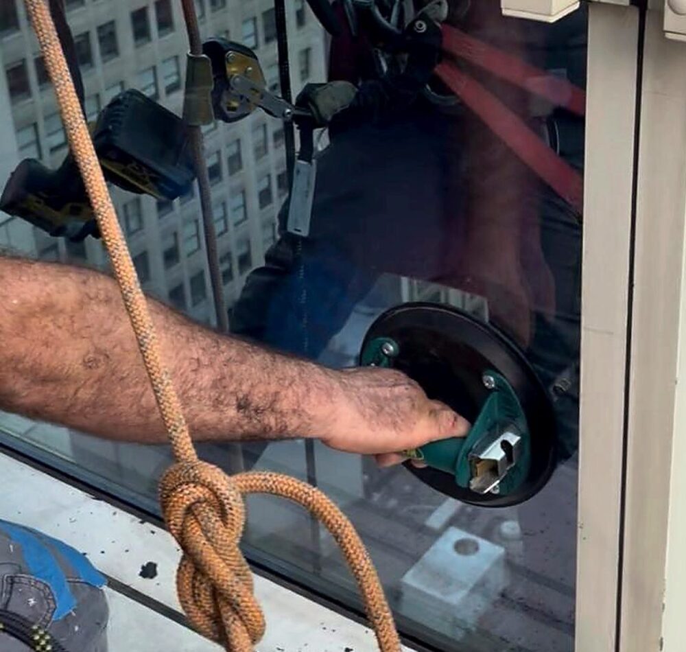 Vacuum lifter used to set a replacement insulated glass unit