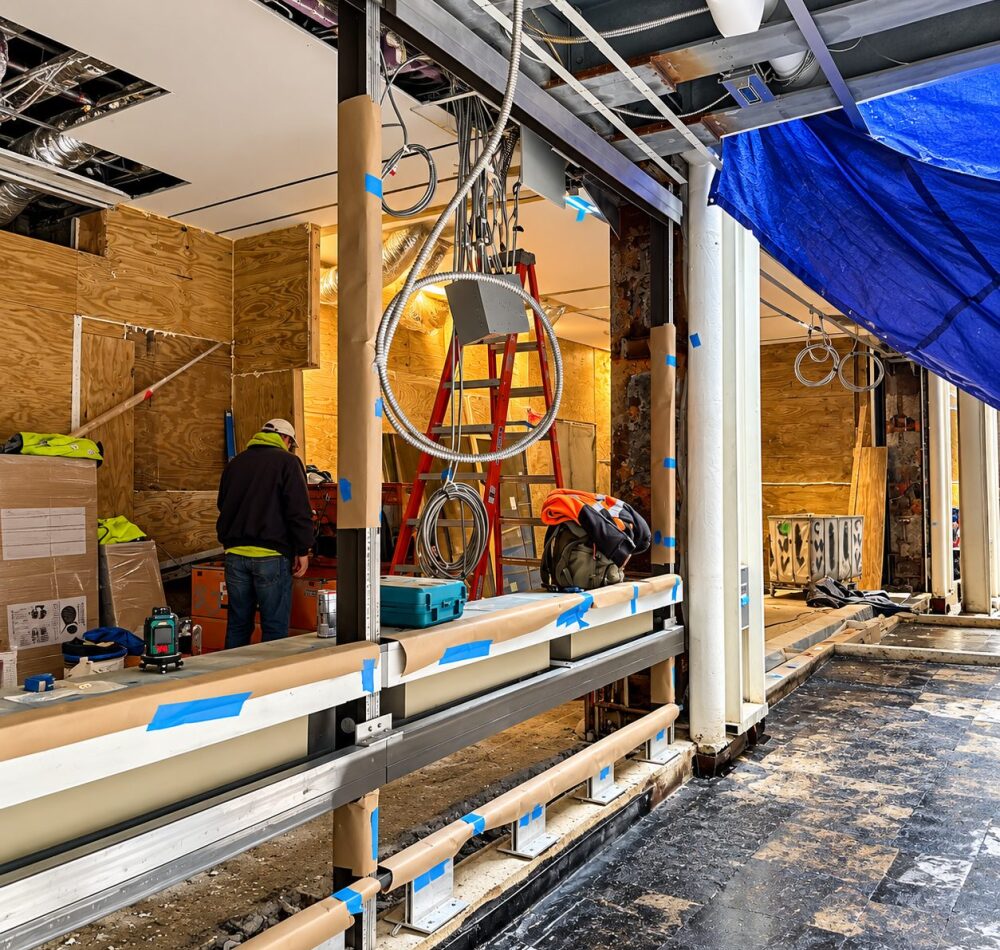 Storefront framing and aluminum sill brackets at 88 Pine Street