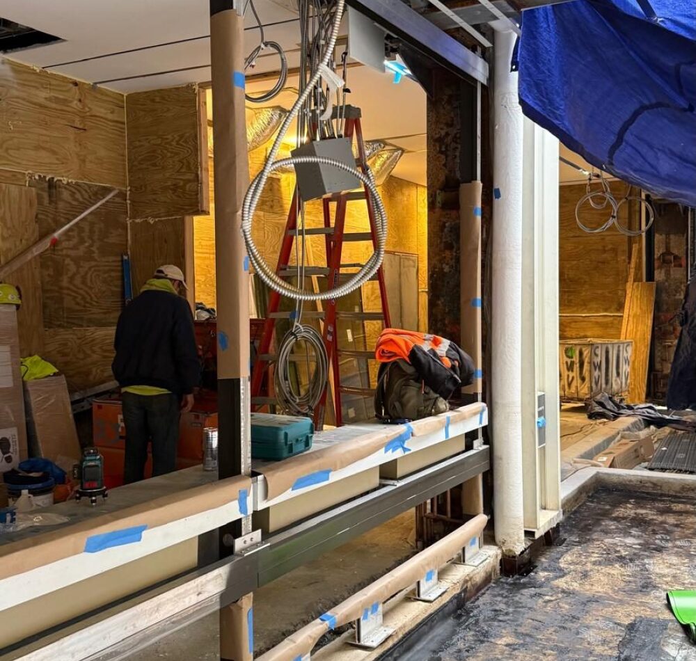 Custom storefront framing under construction at 88 Pine Street